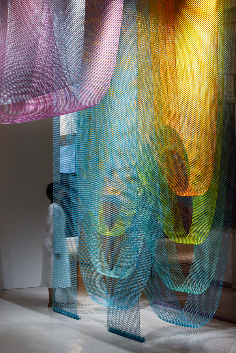 luminous layers of colored wire mesh weave tea ceremony house by moriyuki ochiai