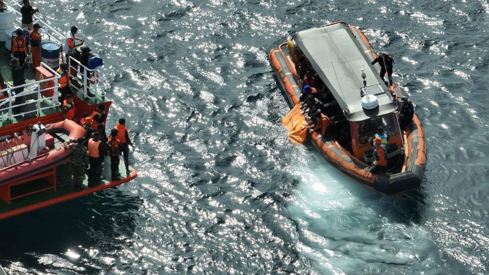 Indonesian rescuers find a second body as search for Spanish soccer coach and 2 children extended