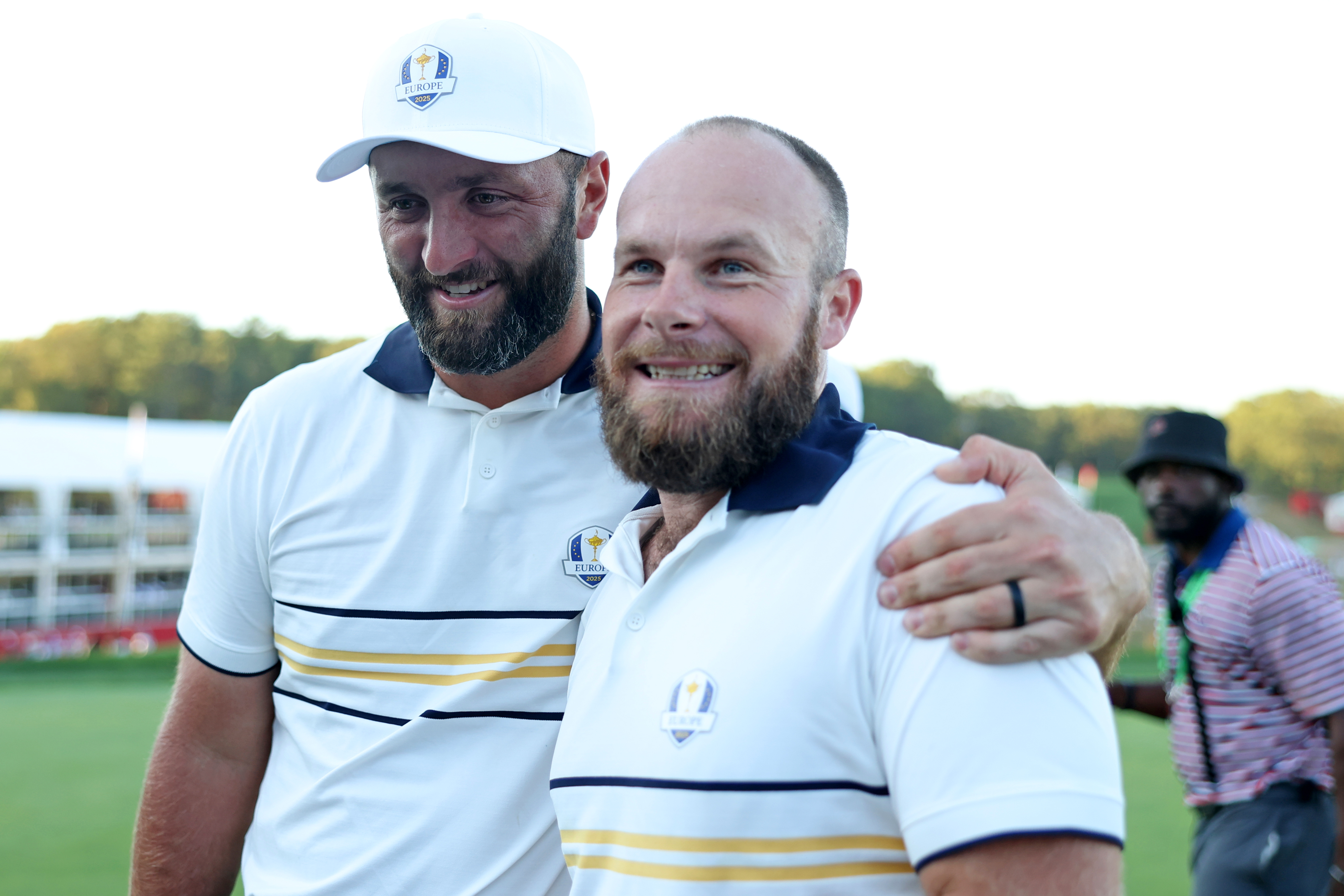 Jon Rahm and Tyrrell Hatton hug during the 2025 Ryder Cup.