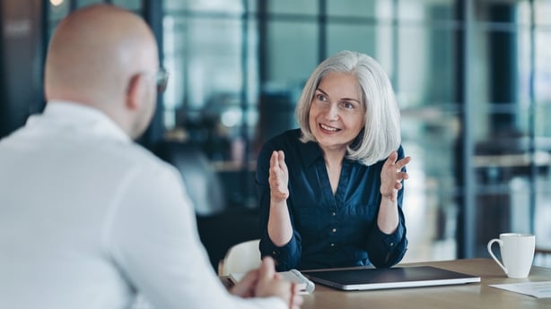 Focus on a mature businesswoman during a meeting