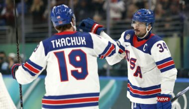 Feb 12, 2026; Milan, Italy;  Auston Matthews of United States celebrates scoring their fifth goal with Matthew Tkachuk of United States against Latvia in men's ice hockey group C play during the Milano Cortina 2026 Olympic Winter Games at Milano Santagiulia Ice Hockey Arena. Mandatory Credit: Geoff Burke-Imagn Images