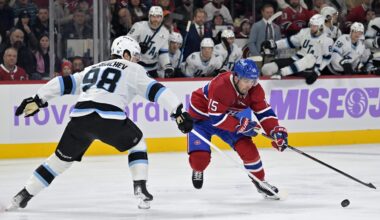 Nov 8, 2025; Montreal, Quebec, CAN; Montreal Canadiens forward Alex Newhook (15) plays the puck and Utah Mammoth defenseman Mikhail Sergachev (98) defends during the first period at the Bell Centre. Mandatory Credit: Eric Bolte-Imagn Images