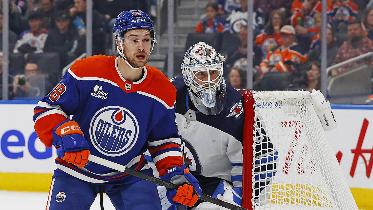 Sep 26, 2025; Edmonton, Alberta, CAN; Edmonton Oilers forward Andrew Mangiapane (88) looks for a pass in front of Winnipeg Jets goaltender Domenic DiVincentiis (50) during the first period at Rogers Place. Mandatory Credit: Perry Nelson-Imagn Images