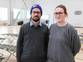 Sarnia's Corey Morden and Jayla Croteau, pictured Saturday, were among those making use of a warming centre at Watford's arena, after a blizzard closed Highway 402.
