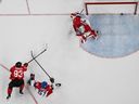 Canada's Mitch Marner shoots and scores during overtime of the men's play-off quarterfinal against Czechia during the Milano-Cortina 2026 Winter Olympic Games. 