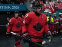 Canada's Sidney Crosby and Mitch Marner walk to the warm-up ahead of the quarterfinal game against Czechia at the 2026 Winter Olympics.