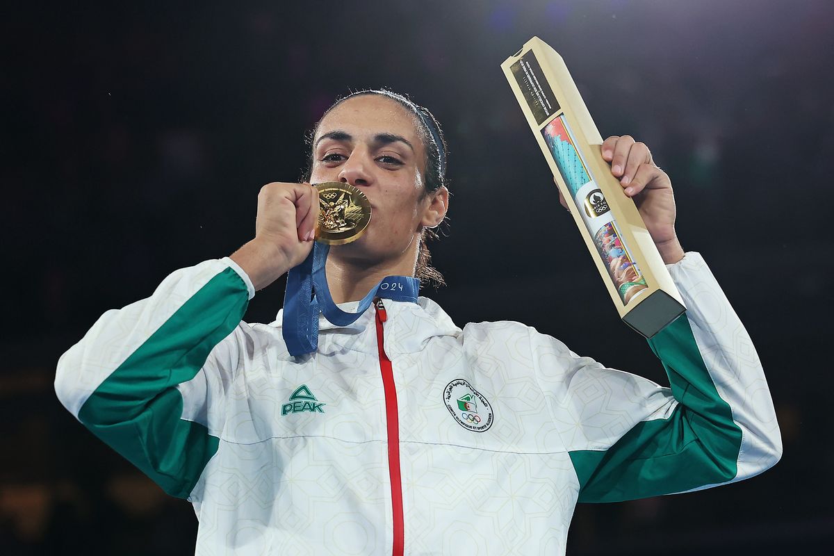 Imane Khelif kisses her Olympic gold medal