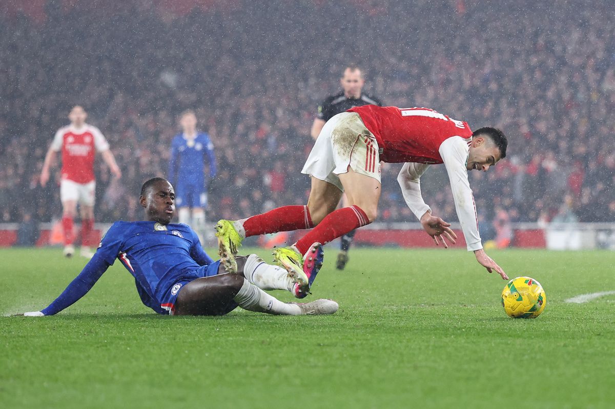 Trevoh Chalobah of Chelsea tackles Gabriel Martinelli of Arsenal in the Carabao Cup semi-final