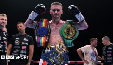 Ryan Garner poses for a photo with the British, Commonwealth, European and WBC International belts