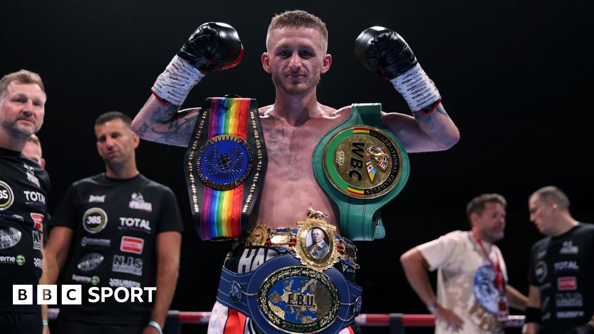 Ryan Garner poses for a photo with the British, Commonwealth, European and WBC International belts