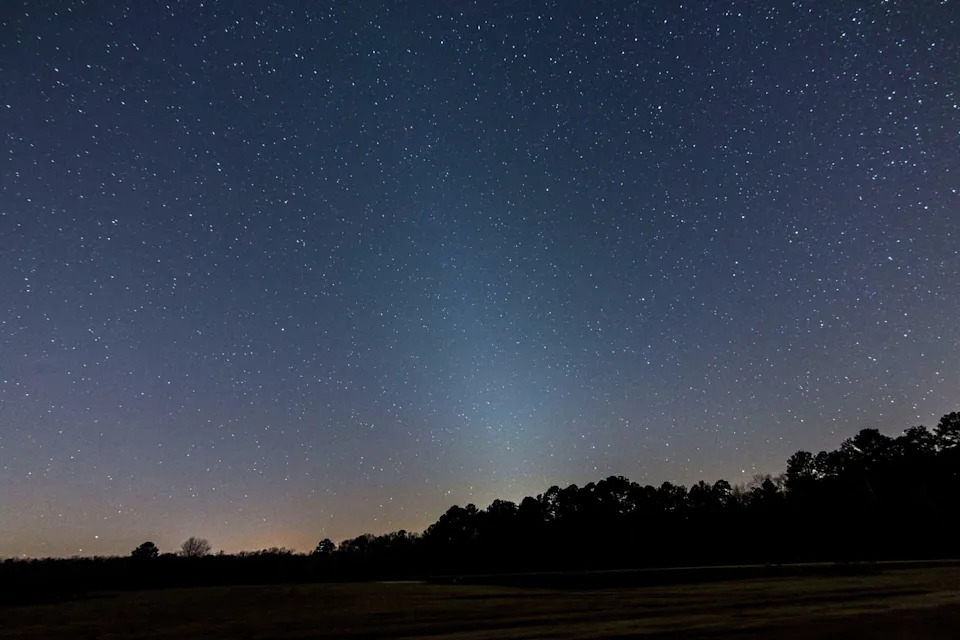 The soft glow of the zodiacal light appears over Georgia's Lake Tobesofkee in early 2016. Credit: Stephen Rahn
