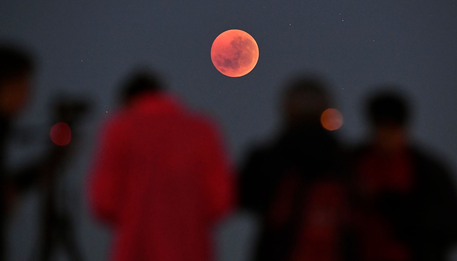People gather to watch a blood moon eclipse in Melbourne on July 28 2018.