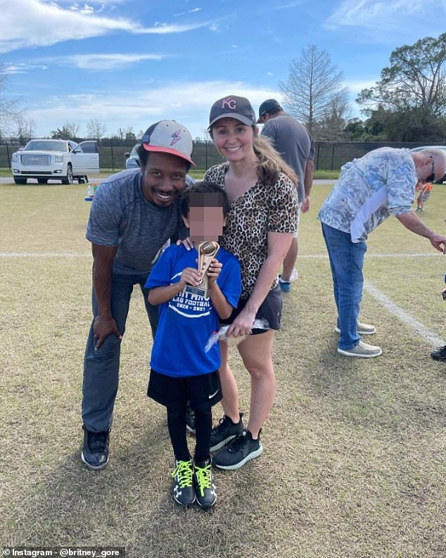 Gore is pictured with his wife Britney and their son Zane after watching him play flag football