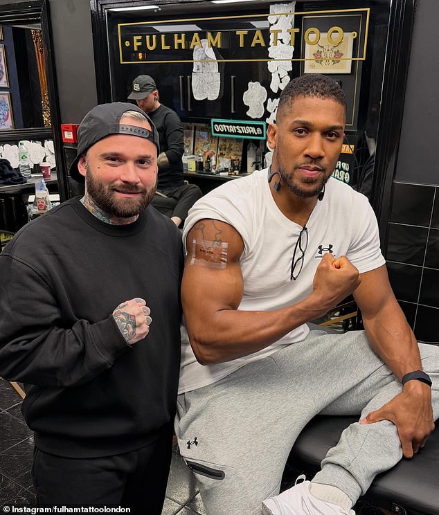 Anthony Joshua has added to his tattoo collection with the names of his late friends