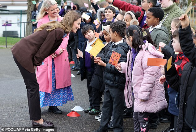 Kate spoke to pupils, many of whom presented her with cards, during her surprise visit this afternoon