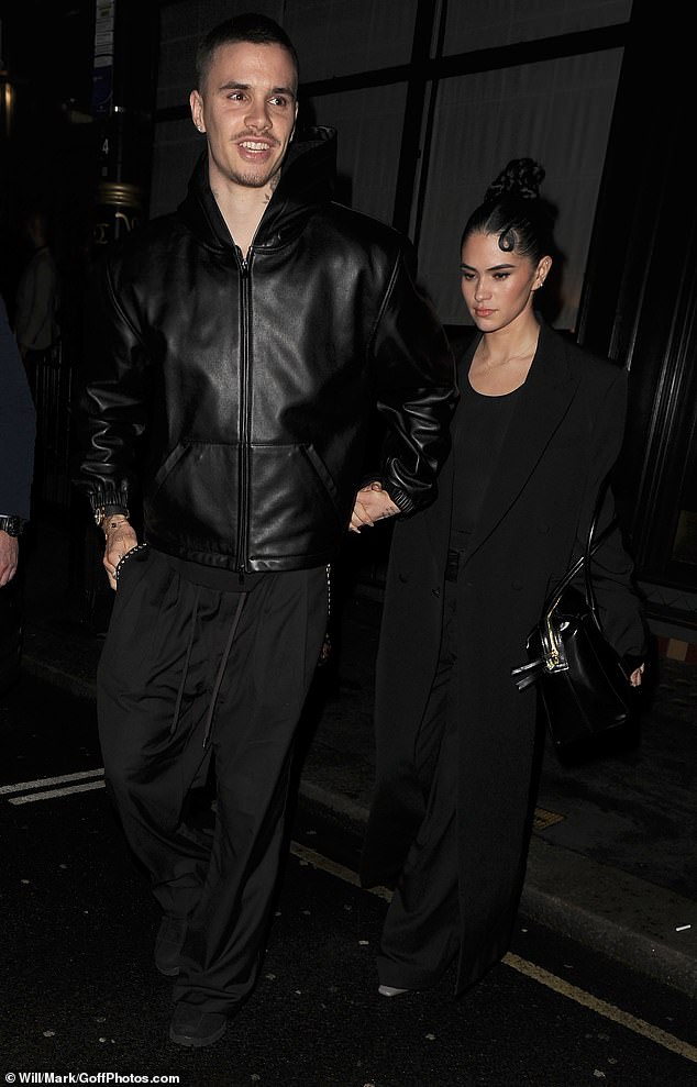 Romeo, 23, and his girlfriend Kim Turnbull looked loved-up as they followed shortly behind