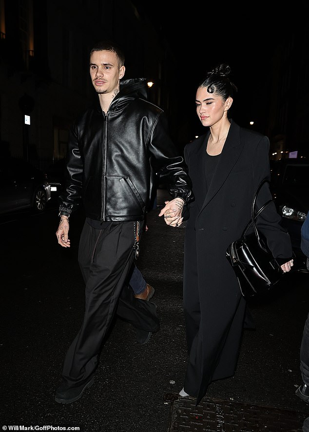 Romeo and his girlfriend Kim looked completely loved-up