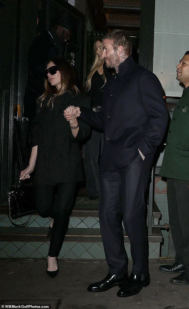 David cut a dapper display in a navy suit