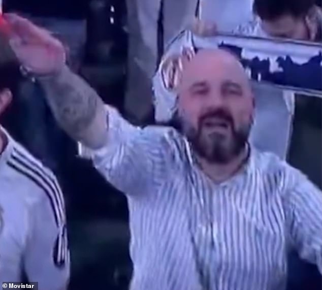 A Real Madrid fan is under investigation after he appeared to perform a Nazi salute