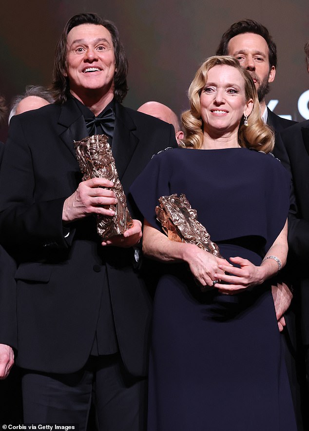The Hollywood funnyman, 64, cut a sleek figure in a sharp all-black suit at Thursday night¿s glitzy ceremony in Paris, held at the legendary L'Olympia; (pictured with Lea Drucker)