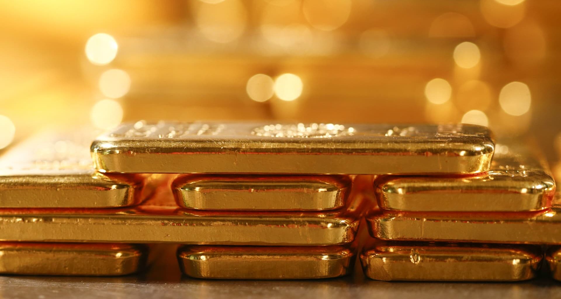 Gold slips to one-week low as safe-haven buying stalls, dollar strengthens
