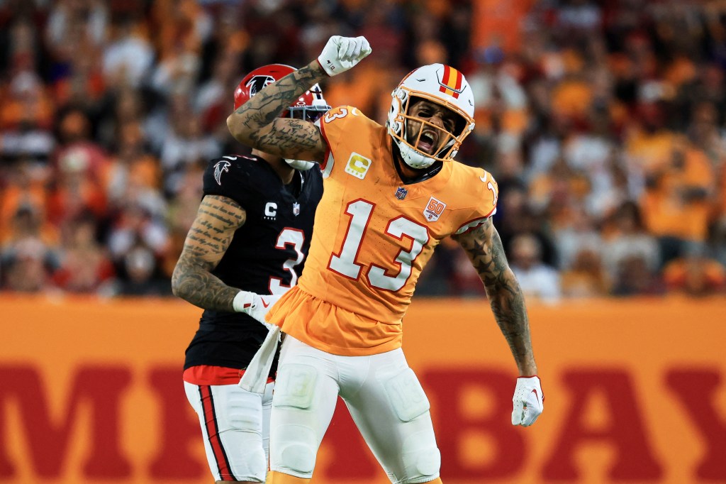 Tampa Bay Buccaneers wide receiver Mike Evans (13) celebrates a catch against Atlanta Falcons safety Jessie Bates III (3).