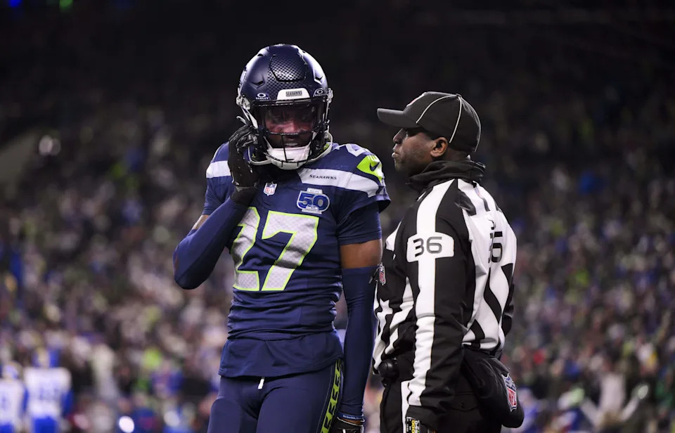 Seattle Seahawks cornerback Riq Woolen (27) comes off the field as a ref talks to him during the fourth quarter of the NFC Championship game against the Los Angeles Rams at Lumen Field, on Sunday, Jan. 25, 2026, in Seattle.