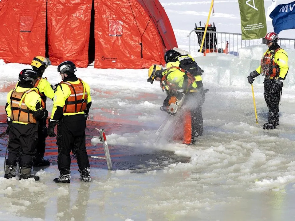 A combination of firefighters, police and Urgences-santé rescue staff prepare the site on the St. Lawrence River for the 18th annual SPVM polar plunge in Montreal.