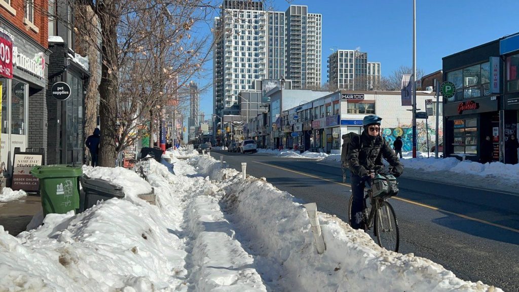 Bike lanes running along Toronto's Bloor Street remain blocked as shown on Sunday Feb. 1, 2026 a week after the city received a historic dump of snow. THE CANADIAN PRESS/Kathryn Mannie