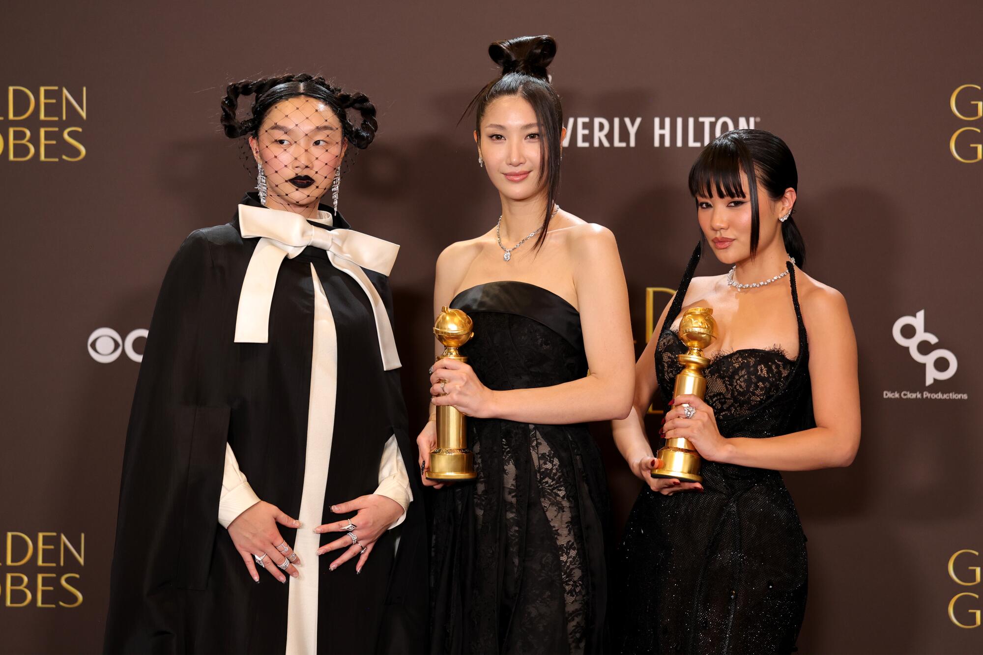 Audrey Nuna, EJAE and Rei Ami pose at the Golden Globes