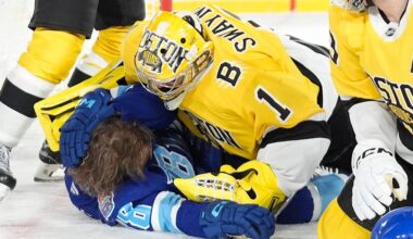 Boston Bruins goaltender Jeremy Swayman (1) takes down Tampa Bay Lightning left wing Brandon Hagel (38) during the second period of a Stadium Series NHL hockey game Sunday, Feb. 1, 2026, in Tampa, Fla. (AP Photo/Chris O