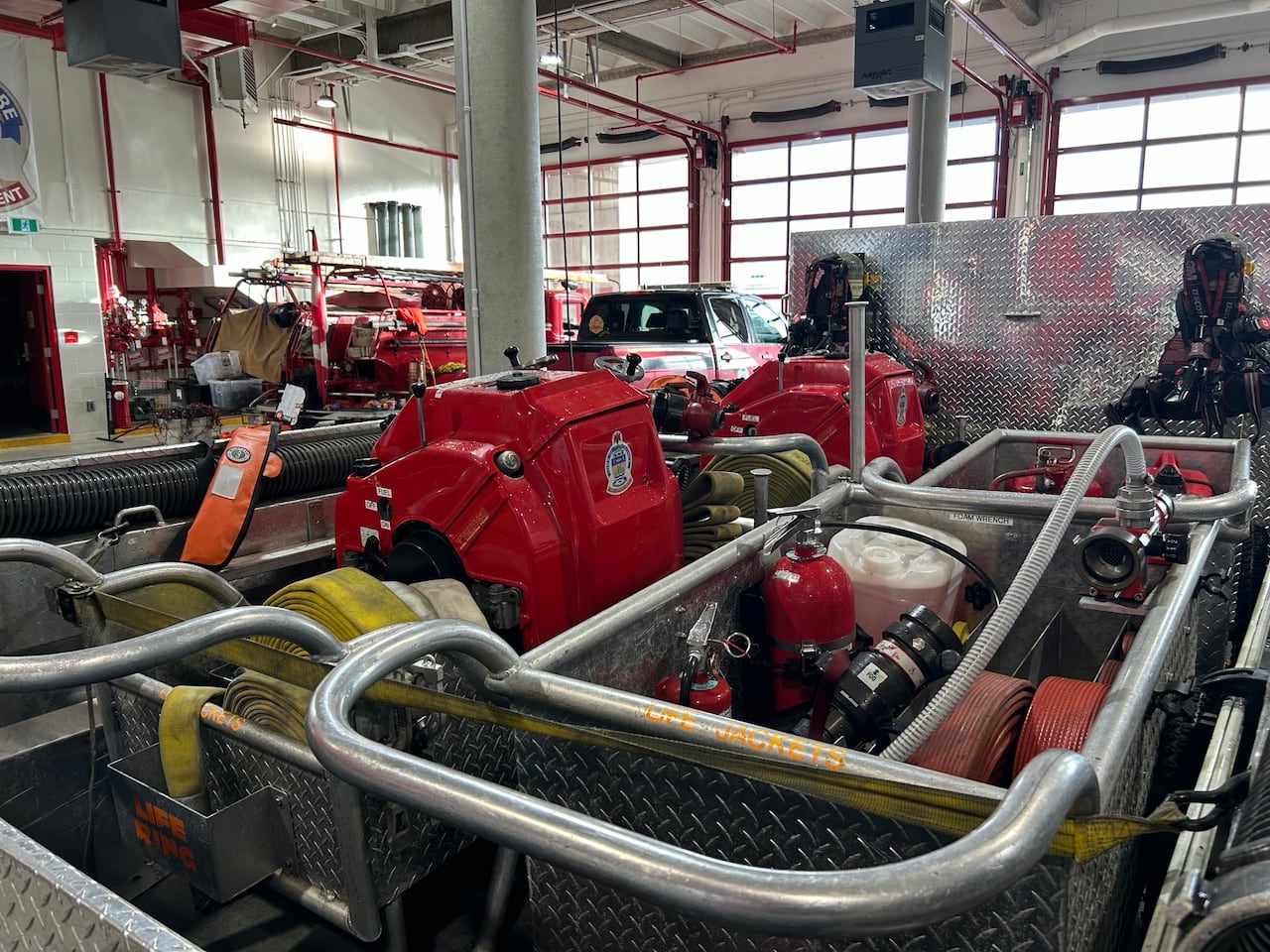 The inside of a marina fire protection trailer includes pumps, hoses and fire extinguishers