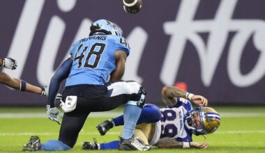 Winnipeg Blue Bombers wide receiver Jerreth Sterns (89) fumbles the football as Toronto Argonauts linebacker Wynton McManis (48) looks on during first half CFL football action in Toronto on Saturday, July 26, 2025. THE CANADIAN PRESS/Nathan Denette