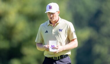 Finn Koelle carries bag during round