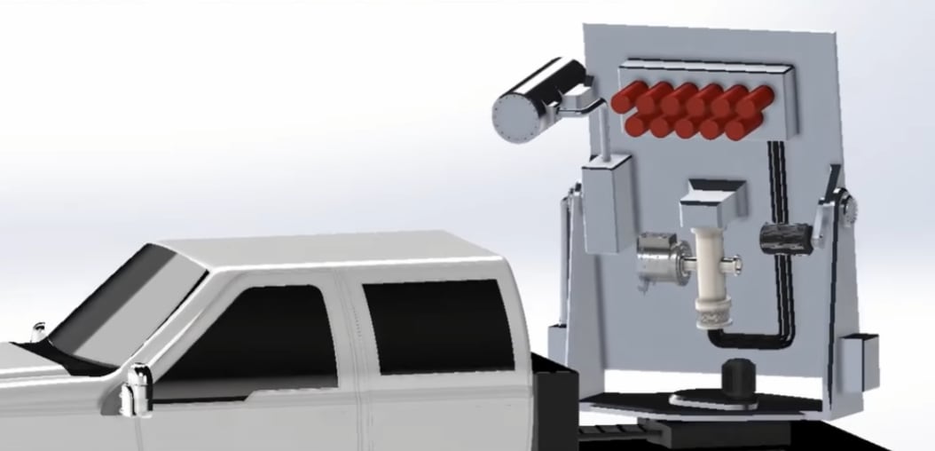 A rendering of a truck with a big piece of equipment on the back