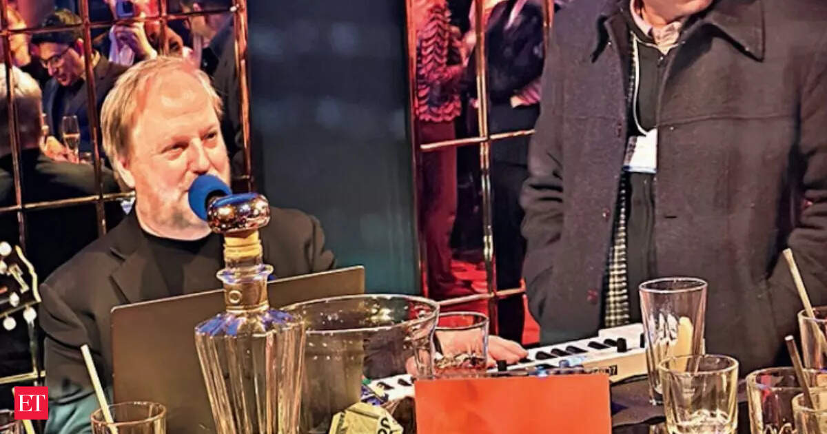 WEF's 'piano man': At Davos, when power falls silent, he makes the world sing