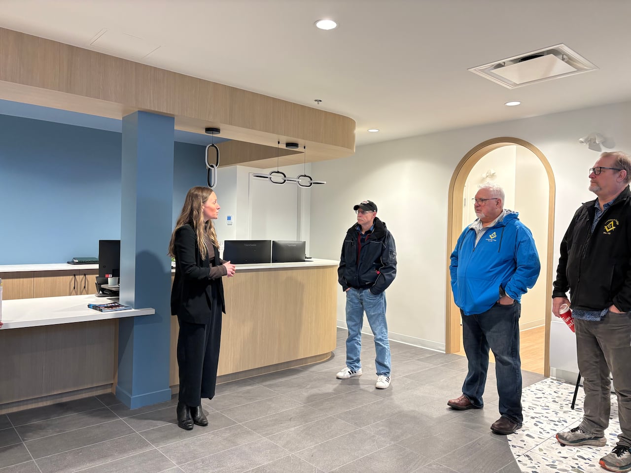 a woman stands in a modern office space