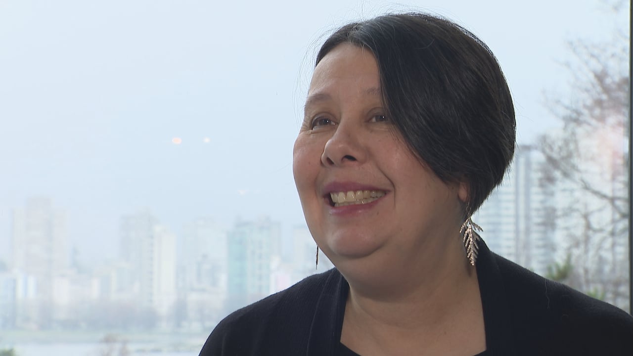 A woman smiling at camera 