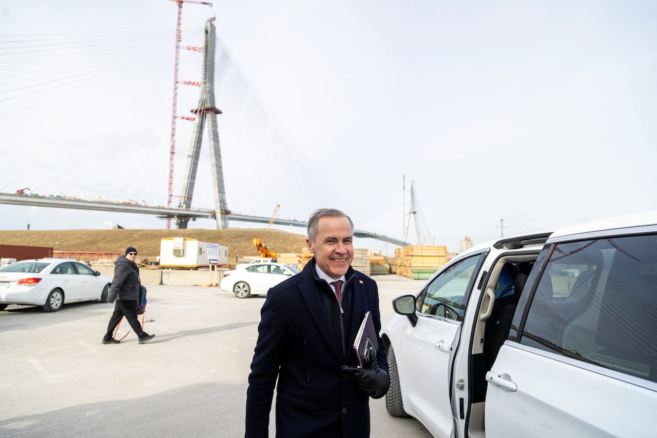 Mark Carney departs after delivering remarks at the still-under-construction Gordie Howe International Bridge in Windsor, Ont., February 5, 2025.
