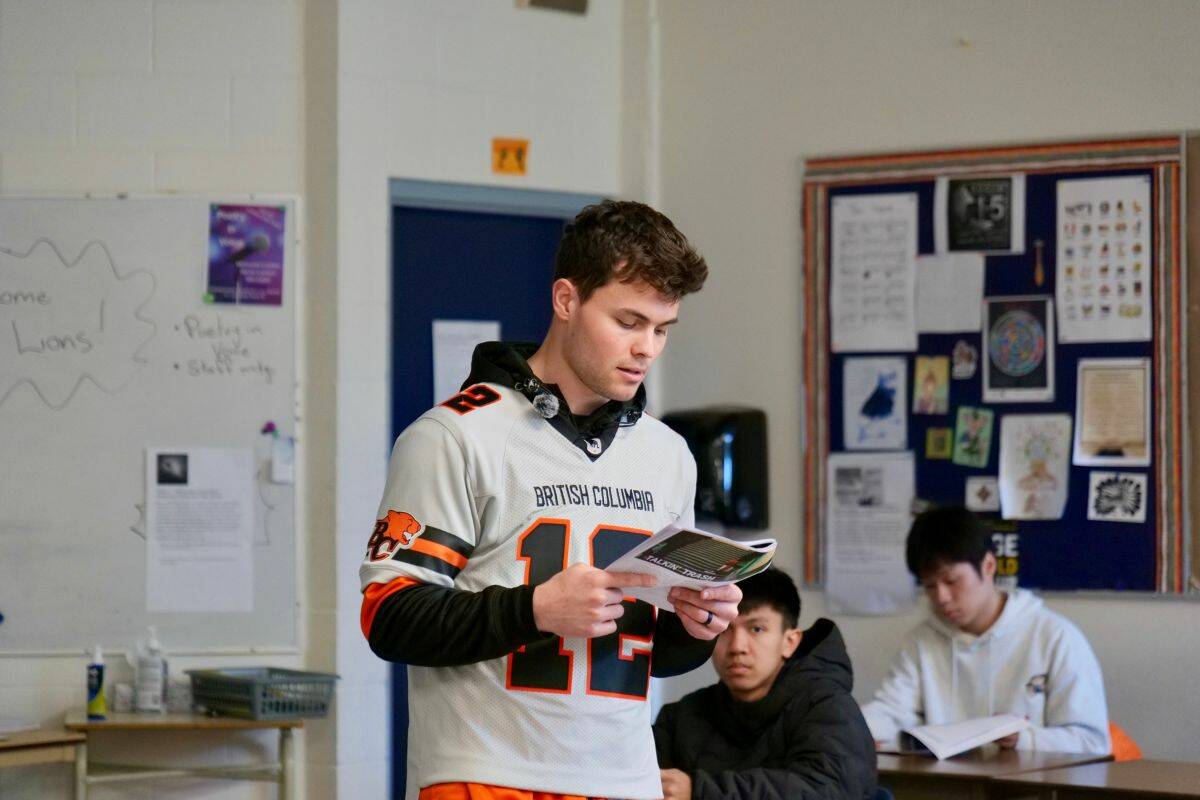 Nathan Rourke chats with students during the Be More Than a Bystander presentation at Lambrick Park Secondary School. (Tony Trozzo/Saanich News)