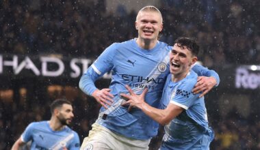 Erling Haaland celebrates making it 3-0 with Phil Foden