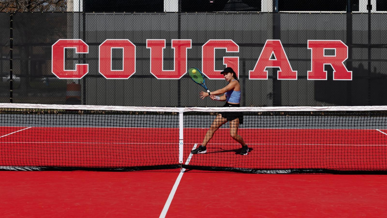 Tennis Ball in score tower with courts in background