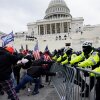 Violent insurrections loyal to President Donald Trump break through a police barrier at the Capitol in Washington on Jan. 6, 2021.