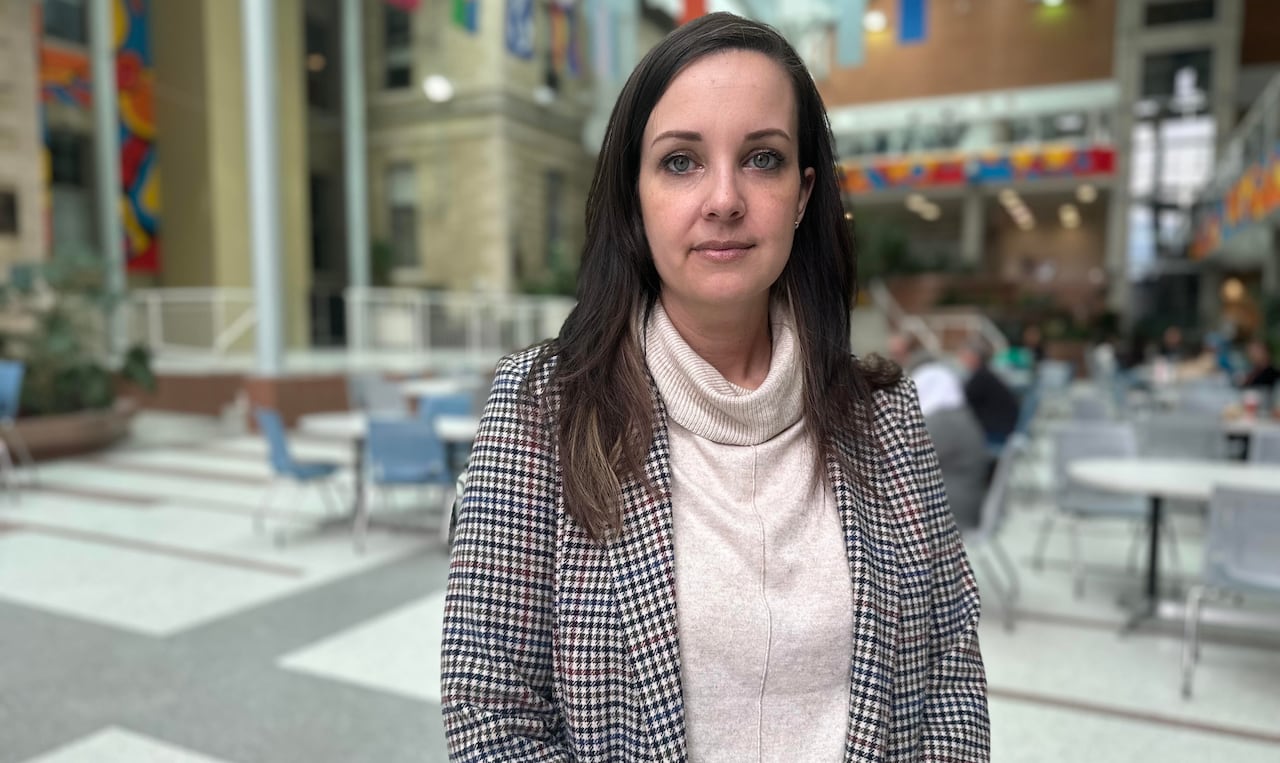 a doctor poses for a picture