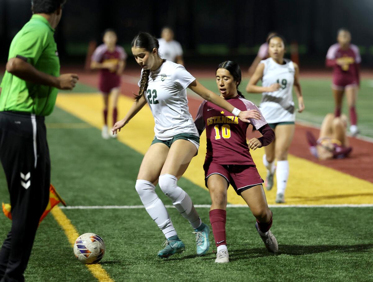 Estancia's Paloma Vallejo (10) battles against Jazelle Touzard (22) of South Hills during Thursday's match.