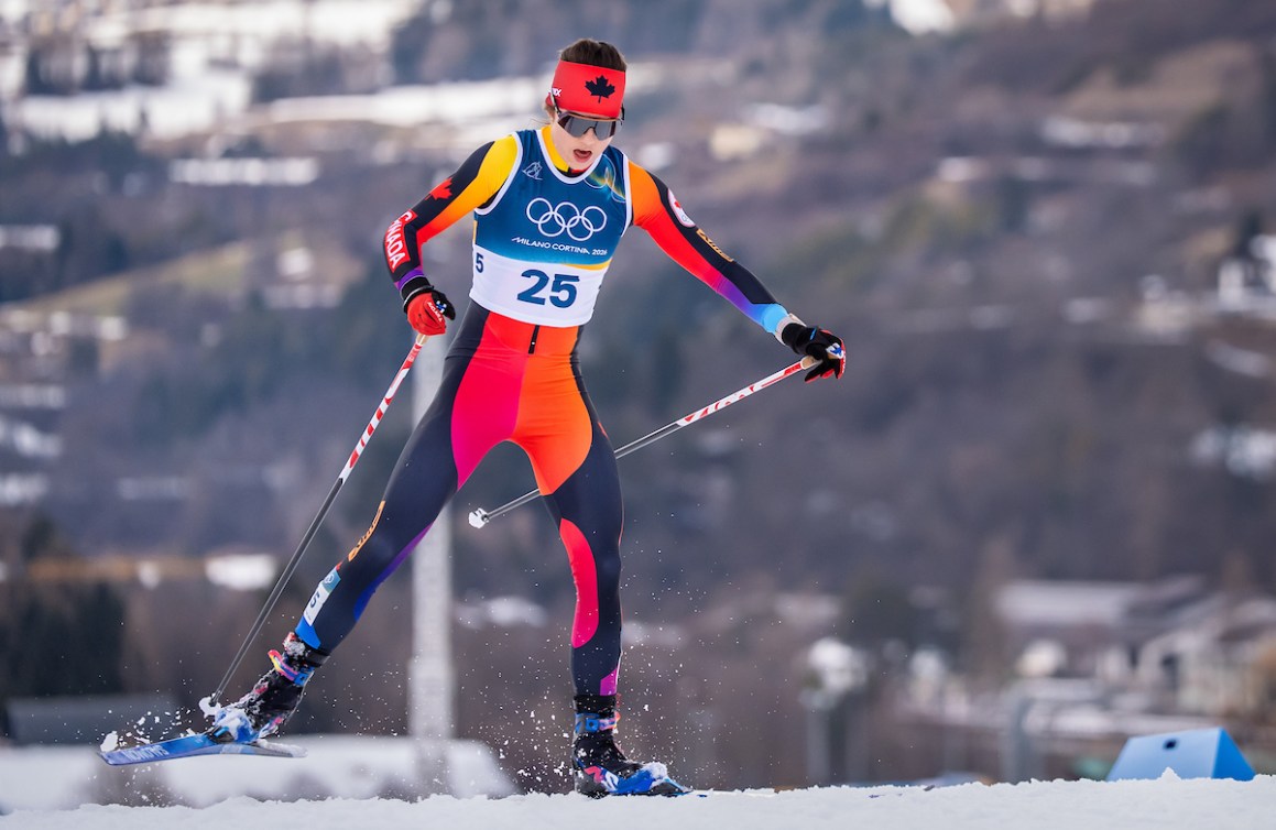Team Canada’s Alison Mackie competes in the women’s 10km + 10km skiathlon at the Tesero Cross Country Stadium during the Milano Cortina 2026 Olympic Winter Games.