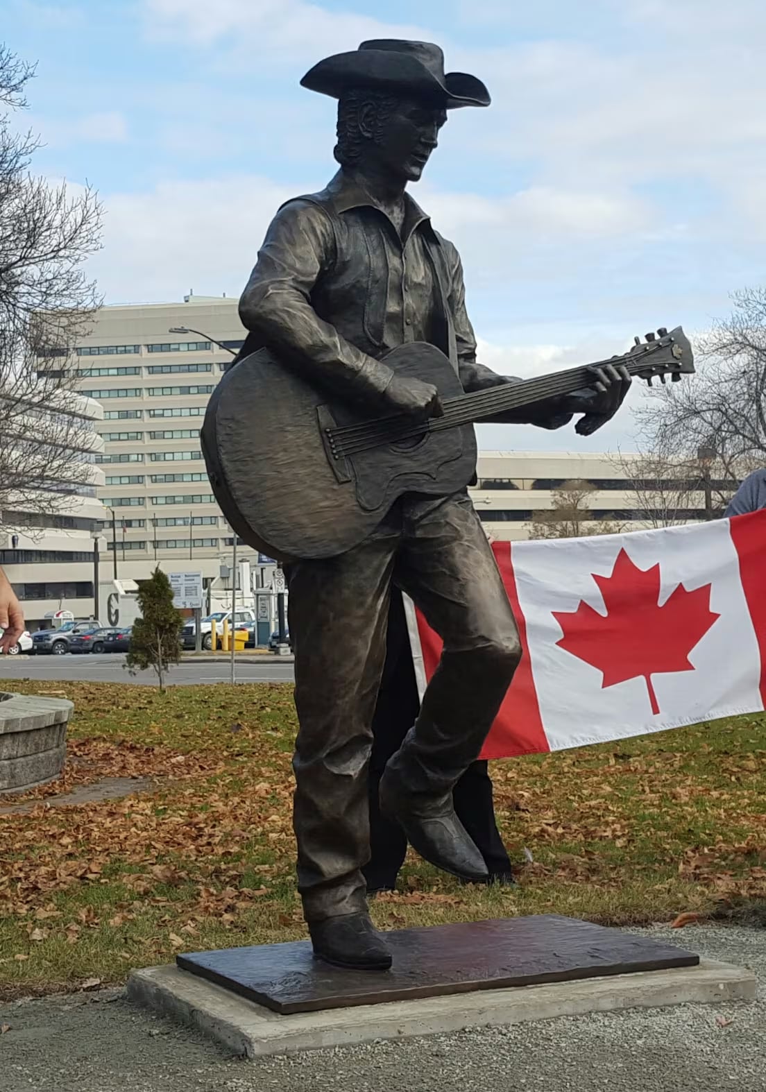 Statue of man playing a guitar.