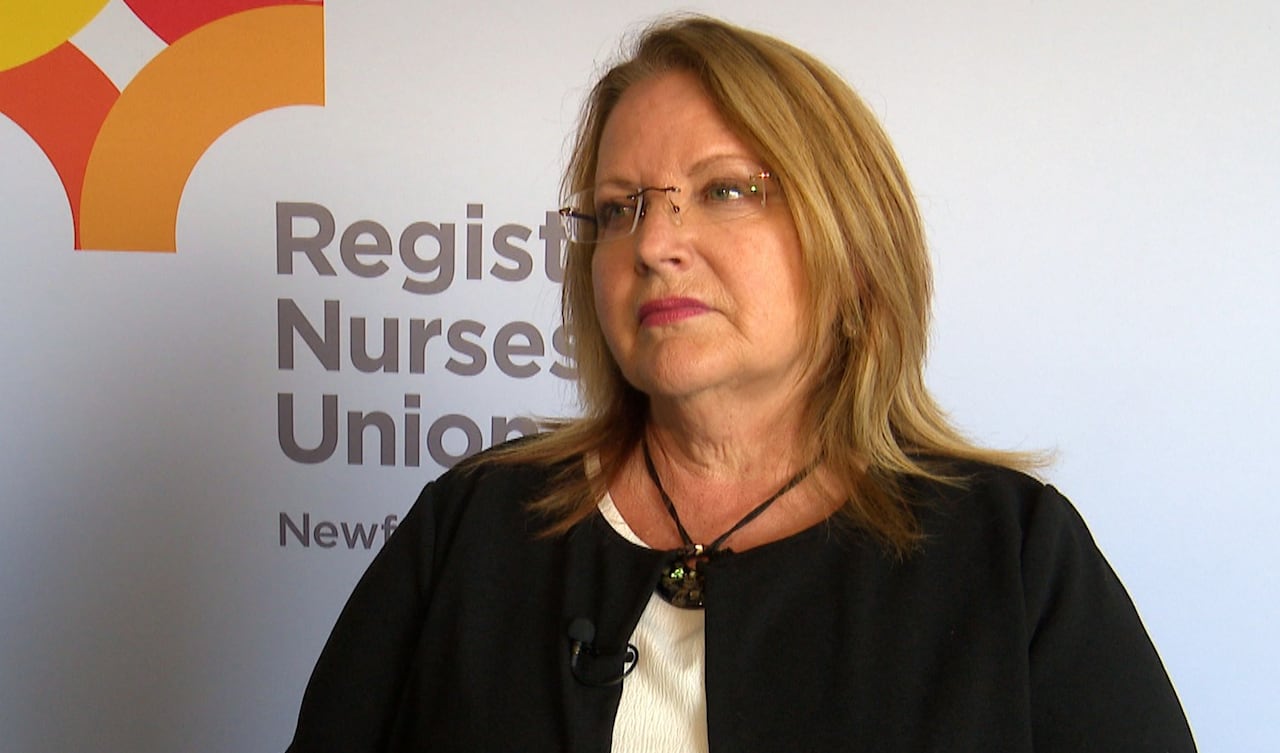 Woman with glasses and black cardign