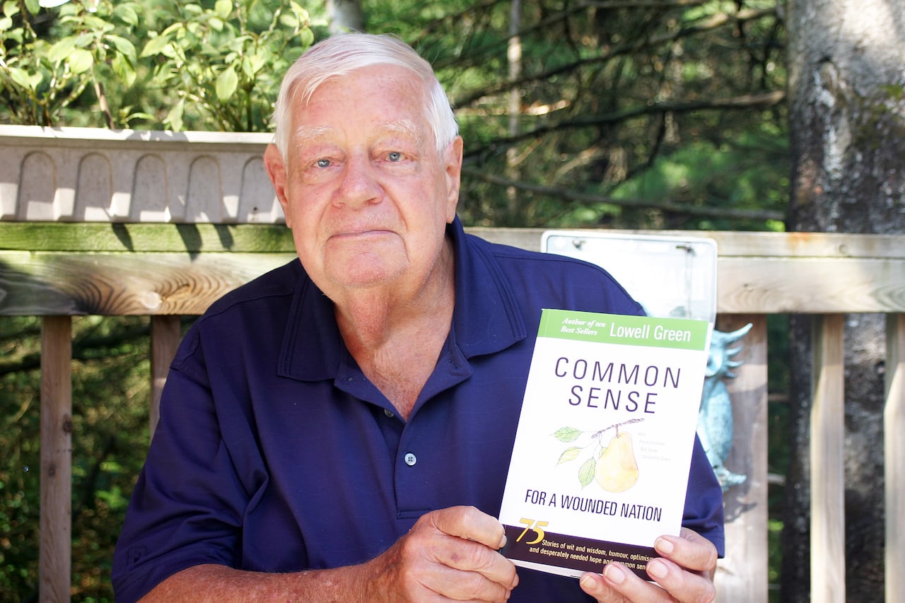 Green pictured holding his book, Common Sense for a Wounded Nation 