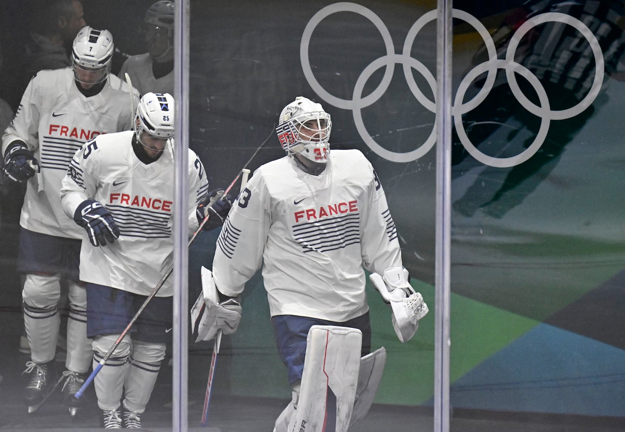 Hockey players walk to the ice.
